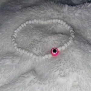 Handmade White Beaded Bracelet with Pink Accent